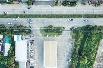 Gas or filling station building in aerial view. May call petrol pump. Include car park, road, mart...