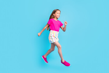 Fototapeta na wymiar Full length photo of pretty nice happy girl jump up run empty space hurry sale isolated on pastel blue color background