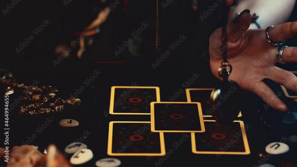 Canvas Prints a fortune teller conjures an amulet over tarot cards spread out on the table. close-up of hands with