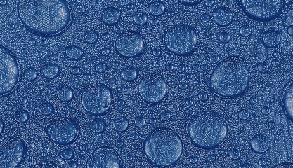 Blue background with texture. The texture formed by bubbles and water droplets sliding on the blue glass. Bitmap image.