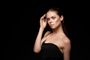 woman model emotions gesture hands bare shoulders dark background