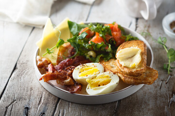 Hard boiled egg, salad and toast for breakfast