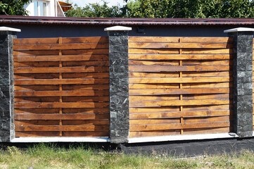 a fence made of wooden interwoven planks