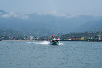 Batumi, Georgia - July 19, 2021: Tourists on a speedboat