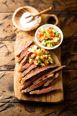 Grilled beef steak with tomato avocado salsa