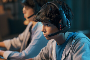 Friends playing online video games together © StockPhotoPro