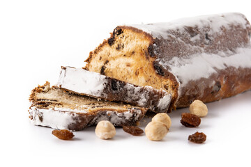 Traditional German Christmas stollen with fruit and nuts isolated on white background