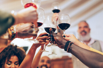 people toasting to success to luck to the new year to profits and love - wedding banquet - celebratory dinner and friends and family holiday - colleagues at restaurant for birthday party