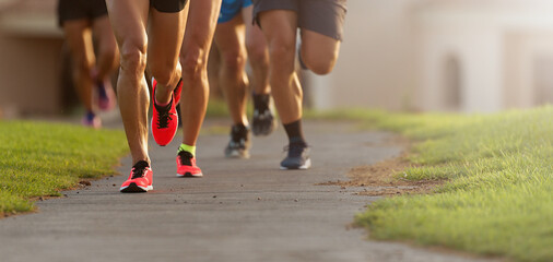 Marathon running race, athletes running on city sidewalk