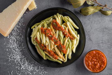 Overview of 3 colors pasta recipe with tomato sauce and cheese