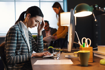 Young businesswoman having a headache