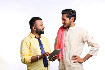 Technology concept : officer showing some detail to farmer in smartphone.