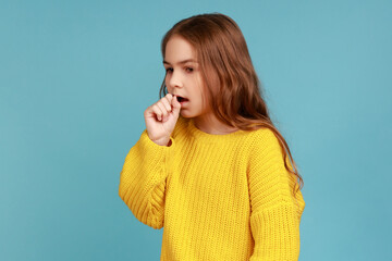 Portrait of unhealthy sick little girl having flu symptoms, coughing, keeping hand near mouth,...