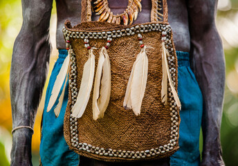 Traditional men's bag of the inhabitants of the village of the Asmat tribe.