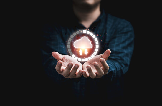 Businessman holding virtual cloud computing with download percentage for transfer data information and upload download application. Technology transformation concept.