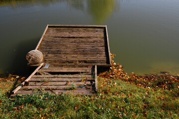 Peaceful rural countryside pond with pontoons.