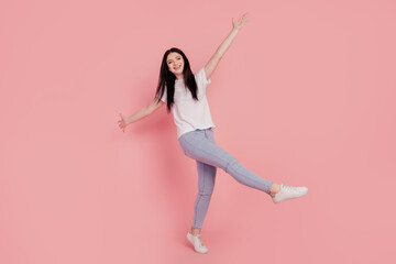 Photo of nice dancer disco modern funny brunette lady stand one leg have fun isolated on pink color background