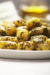 Traditional gnocchi with pesto sauce on gray concrete background, selective focus. It usually prepared with potato and dough