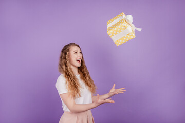 Photo of young attractive woman happy positive smile catch present gift box air fly isolated over...
