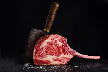 Fresh tomahawk steak on old board - 465013897