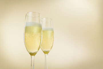 Champagne glasses. The second glass is a little bit blurred.