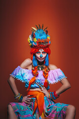 colored,Portrait Of Calavera Catrina on an orange background.Woman dressed as Catrina. Traditional Mexican female skeleton symbolizing death