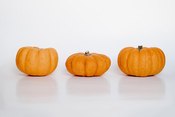 three small pumpkins