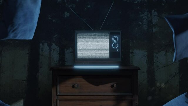 haunted room with an old television and flying pillows in front of bright static screen