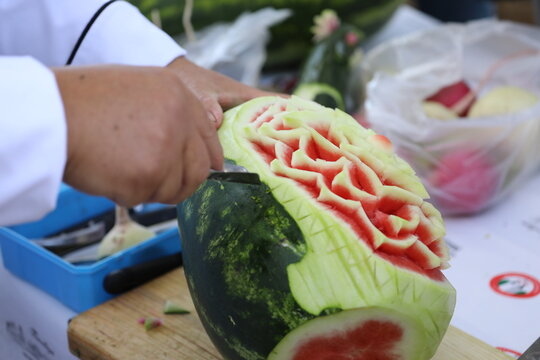 Pumpkin and some vegetables carved with carving knife to get flower design