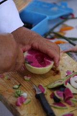 Pumpkin and some vegetables carved with carving knife to get flower design