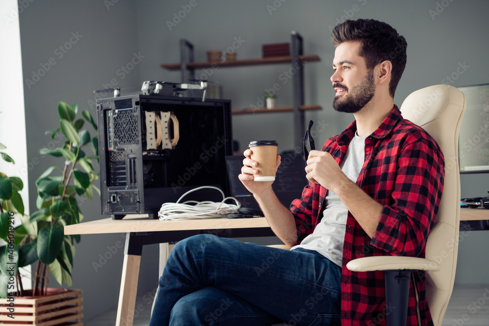 Poster profile side view portrait of attractive intellectual cheerful dreamy guy hacker drinking latte at w