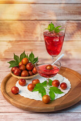 red cherry plum in a wine glasses