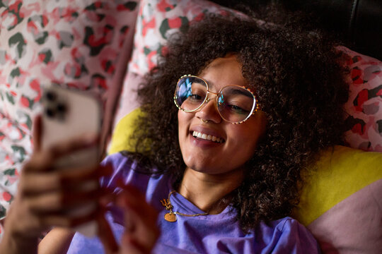 Overhead shot of young adult female looking at a smartphone