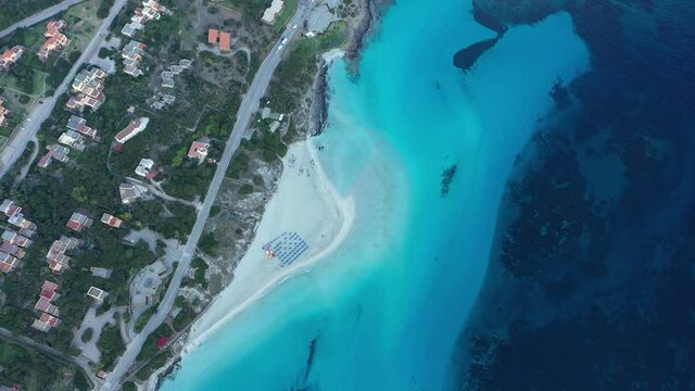 View from above, stunning aerial aerial view of La Pelosa Beach bathed by a turquoise, crystal clear water. Spiaggia La Pelosa, Stintino, north-west Sardinia, Italy