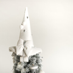 Isolated top of gray-white Christmas tree on white background 