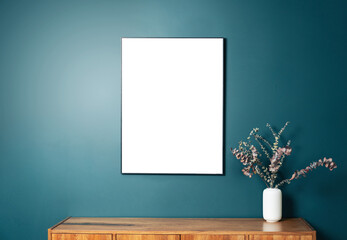 Blank picture frame mockup on green wall. View of modern scandinavian style interior with artwork...