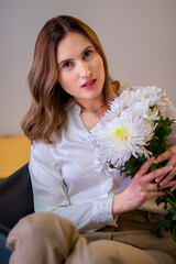 woman in a white shirt with flowers