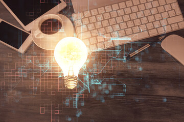 Double exposure of bulb drawing over table with phone. Top view. Concept of idea.