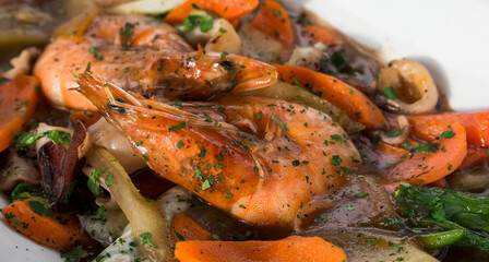 Closeup of Chop Suey with juicy jumbo shrimp and squid rings.