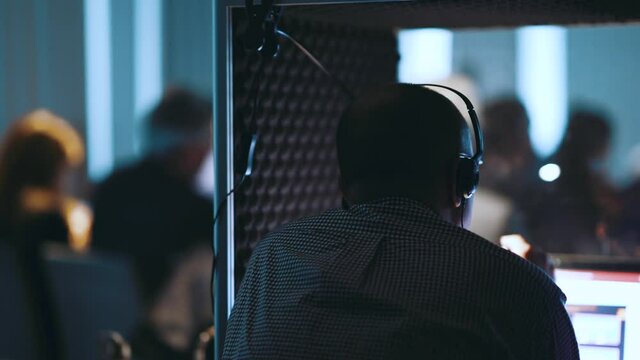 An online translator is wearing headphones at the event