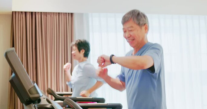 elder couple run on treadmill