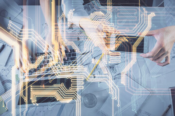 Double exposure of man and woman working together and technology theme drawing. Computer background. Top View. High tech concept.