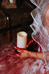 Halloween, a bride with bloody hands holding a candle