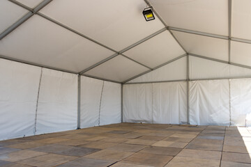 Large white wedding or entertainment event tent interior view © Tminaz