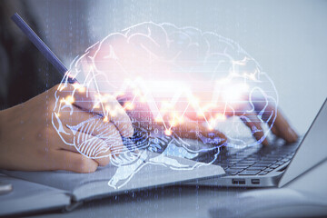 Multi exposure of woman hands working on computer and human brain hologram drawing. Ai tech concept.