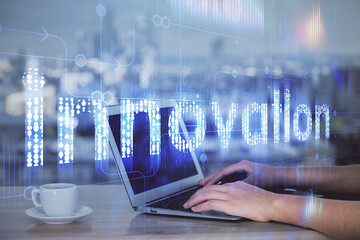 Multi exposure of woman hands working on computer and data theme hologram drawing. Tech concept.