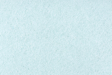 Fototapeta na wymiar Turquoise colored sand background texture. Full frame