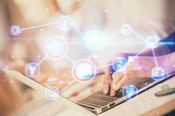 Double exposure of woman hands typing on computer and social network theme hologram drawing. People media concept.