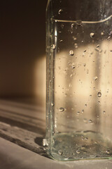 wet vase close-up. glass vase with water drops on it. wet jug close up. drops of water on a vase