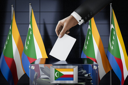 Comoros flags, hand dropping ballot card into a box - voting, election concept - 3D illustration